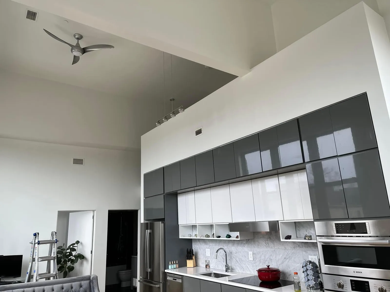 Modern kitchen with cabinets refinished in deep charcoal