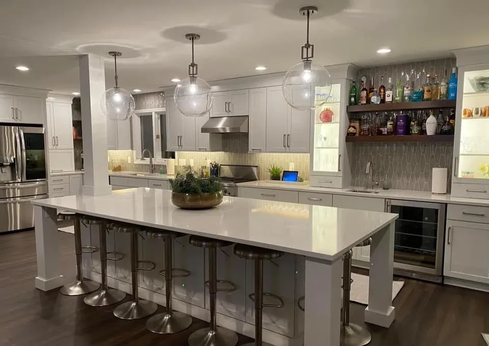 Kitchen cabinets refinished in bright white around a large center island