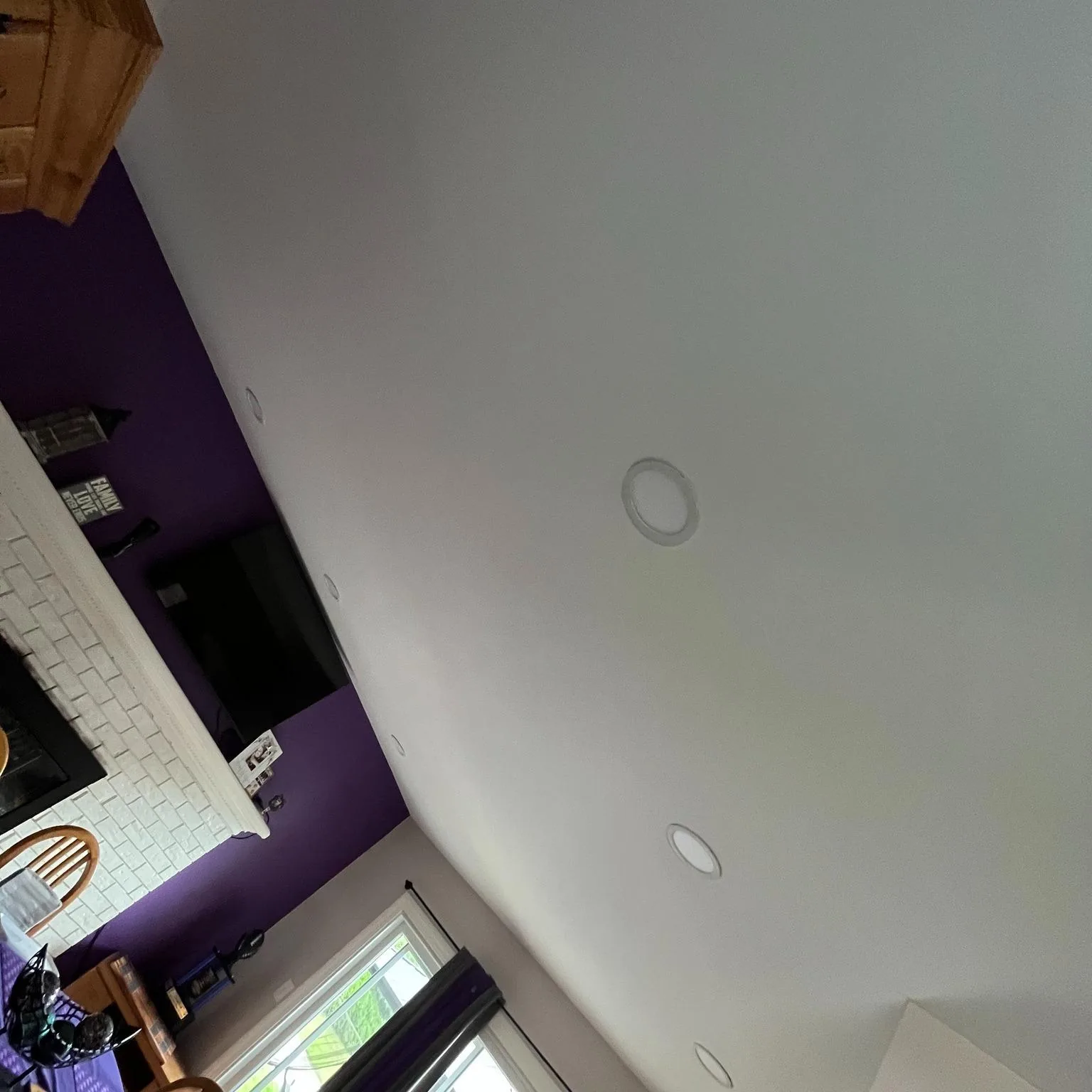 Room with a repaired ceiling and a freshly painted accent wall