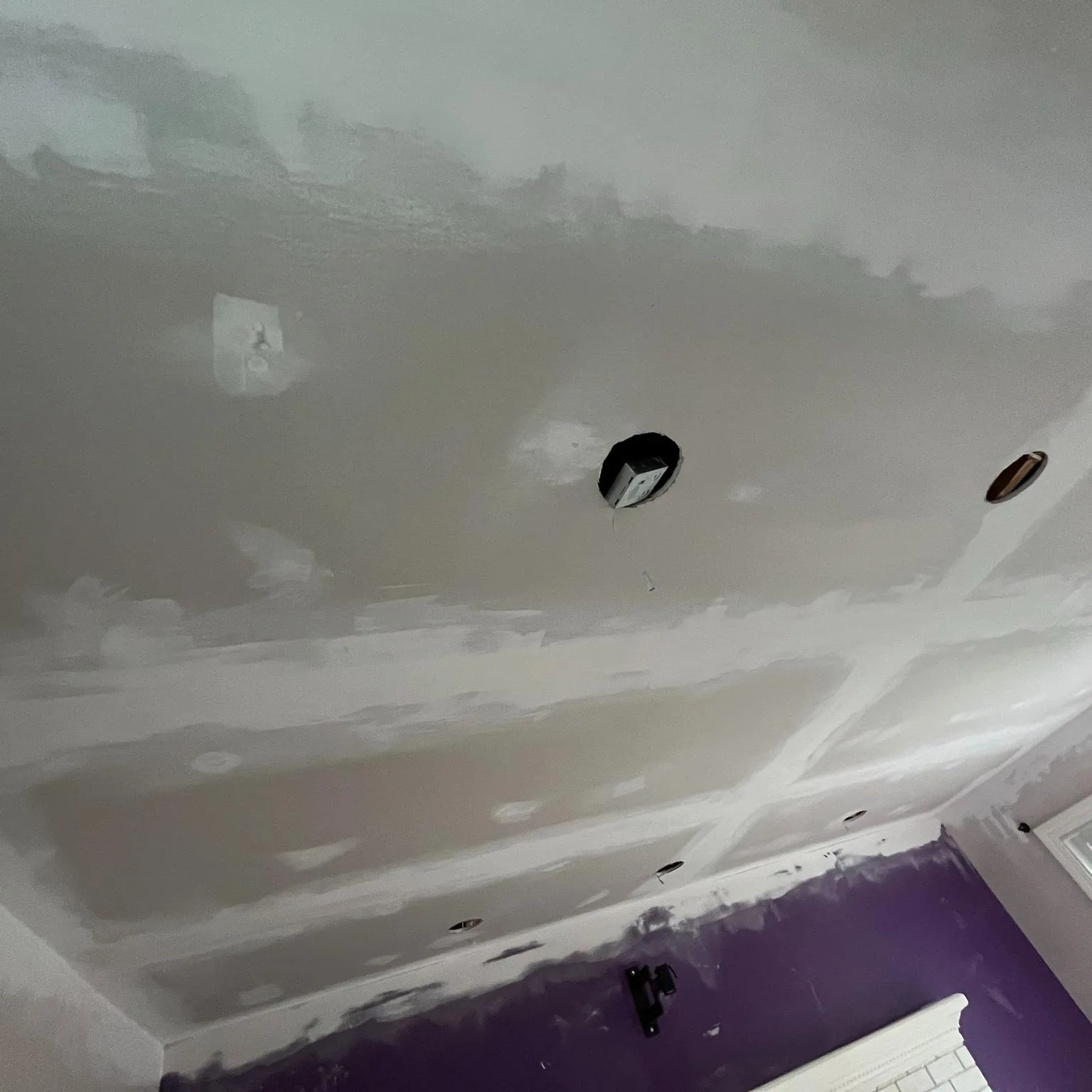 Ceiling skim-coated to a smooth, paint-ready finish