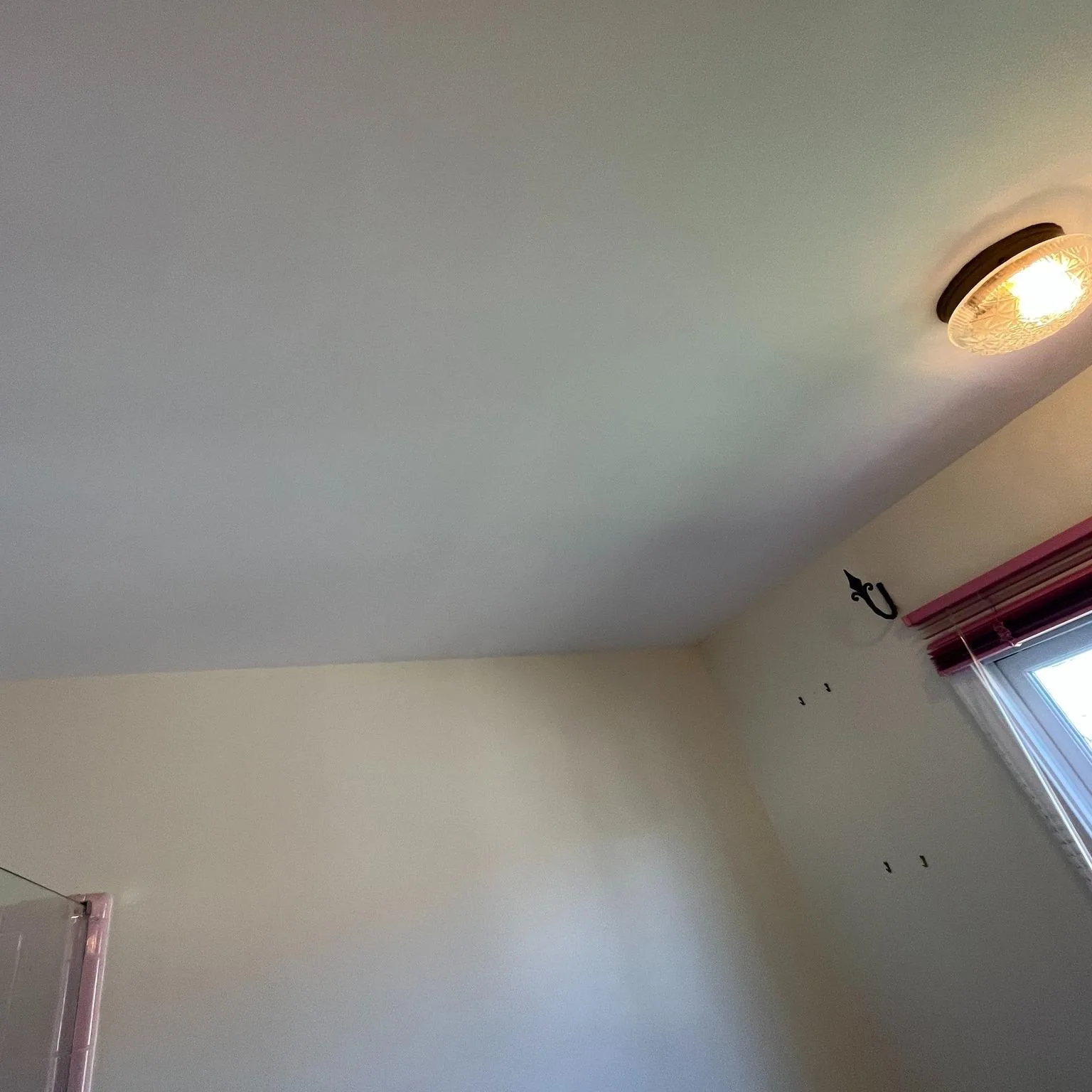 Vaulted ceiling repaired and finished smooth around a skylight