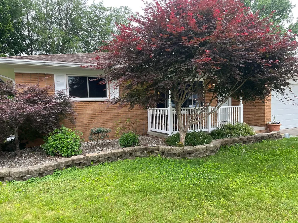 Brick ranch home with repainted trim, soffits, and fascia