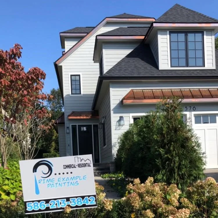 Two-story home exterior repaint with a Prime Example Painting yard sign out front