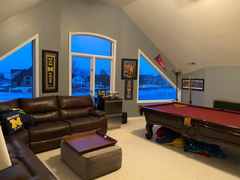 Finished bonus room with a pool table and freshly painted walls